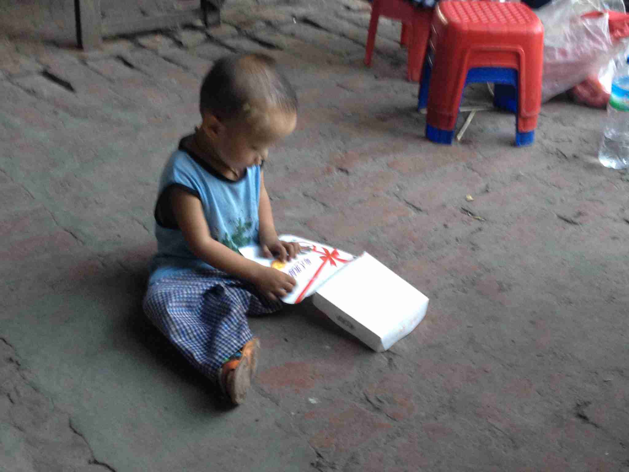 Child playing with box