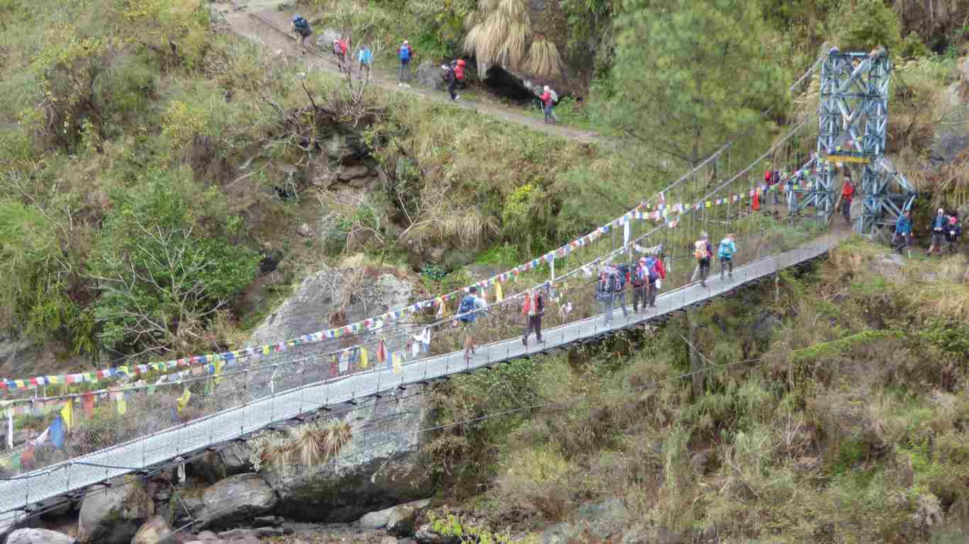 The first suspension bridge with the procession of trekker lemmings