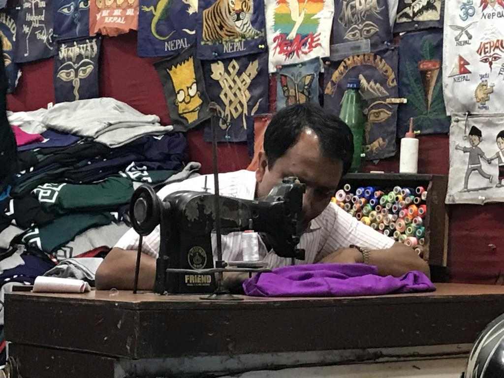 This tailor works old-style