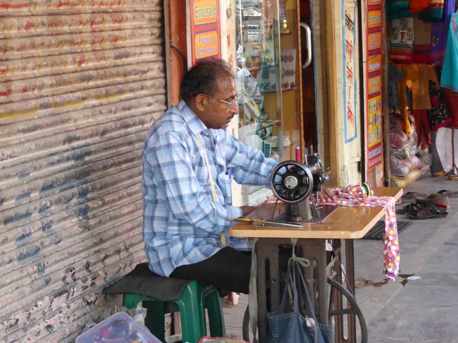 Tailor at work on the sidewalk